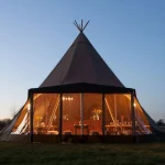 Wedding tipi with panoramic wall of windows